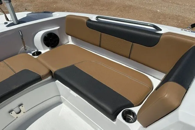 Slide: The Image of 2027 Tahoe 2150 boat interior with brown and black seating. - 17