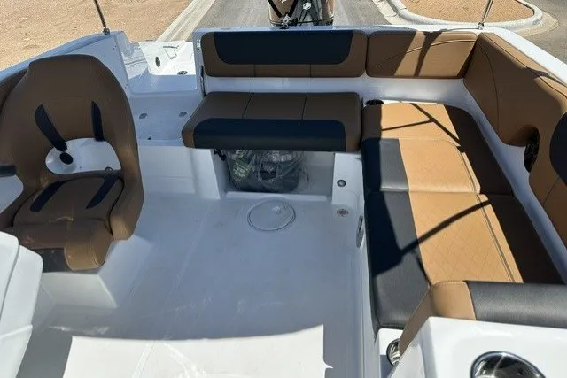 Slide: The Image of Interior of 2027 Tahoe 2150 boat with brown and black seating arrangement. - 14