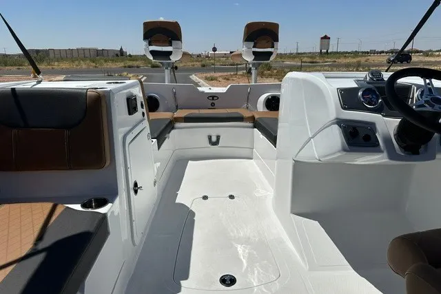 Slide: The Image of 2027 Tahoe 2150 boat interior with modern seating and dashboard, showcasing sleek design and functionality. - 16