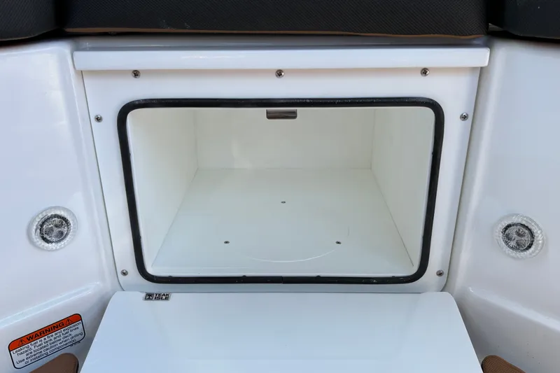 Slide: The Image of Storage compartment on a 2027 Tahoe 210 S boat, featuring a white interior. - 35