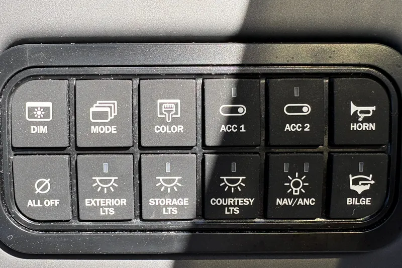 Slide: The Image of Control panel of a 2027 Tahoe 210 S boat with various function buttons. - 45
