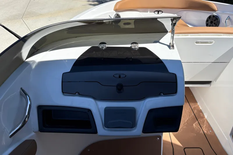 Slide: The Image of 2027 Tahoe 210 S boat dashboard with sleek design and modern controls. - 38