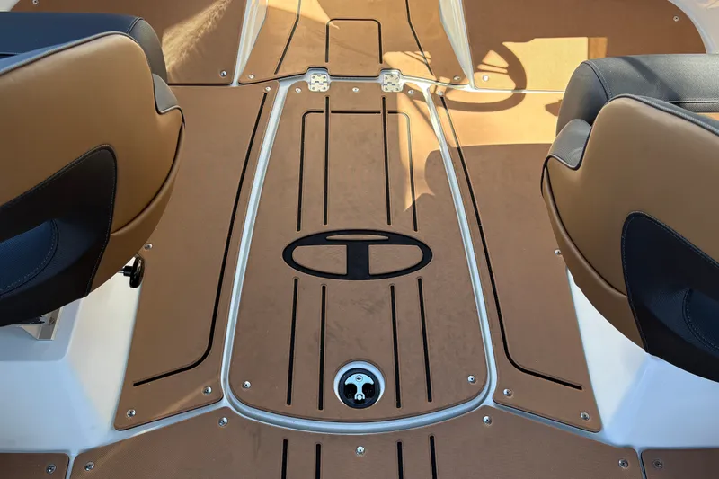 Slide: The Image of Interior of 2027 Tahoe 210 S boat with tan and black seating. - 23