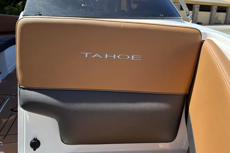 Slide: The Image of 2027 Tahoe 210 S boat seat with tan and gray upholstery. - 25
