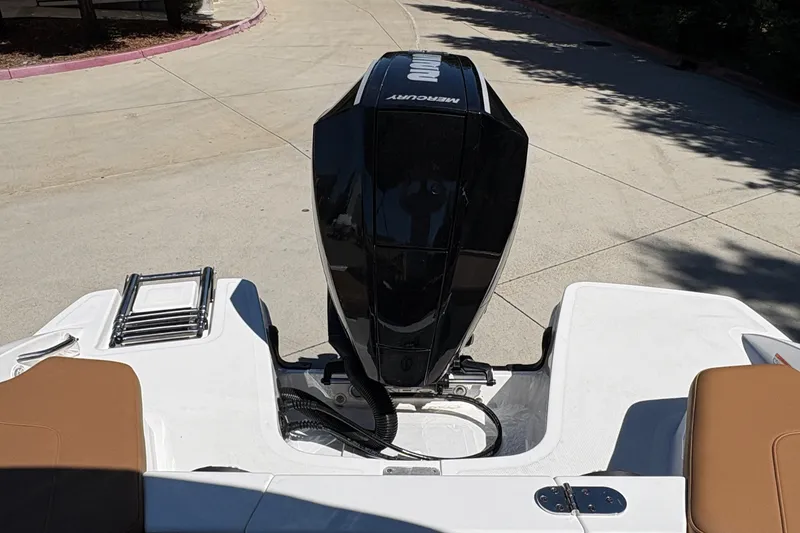 Slide: The Image of 2027 Tahoe 210 S boat with Mercury outboard motor, rear view. - 13