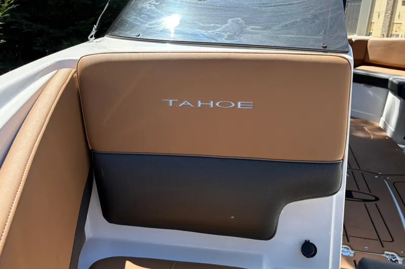 Slide: The Image of 2027 Tahoe 210 S boat interior with tan and black seating. - 54