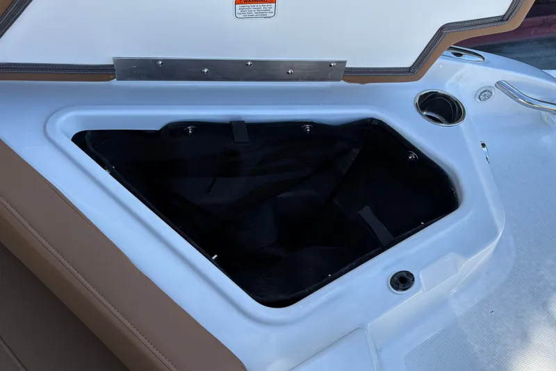 Slide: The Image of Open storage compartment on a 2027 Tahoe 210 S boat, featuring a sleek design. - 43