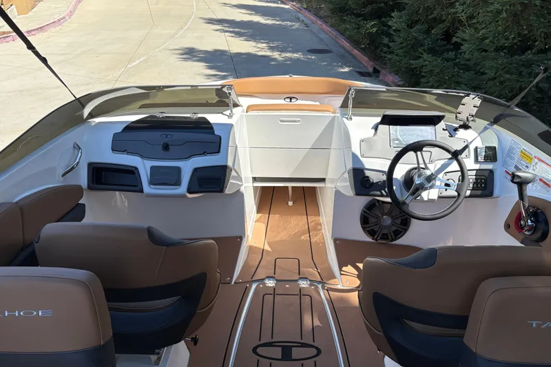 Slide: The Image of Interior view of a 2027 Tahoe 210 S boat, featuring modern dashboard and seating. - 19