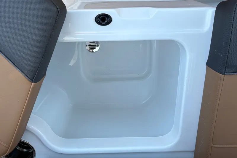 Slide: The Image of Interior compartment of 2027 Tahoe 210 S boat, featuring sleek white design. - 39