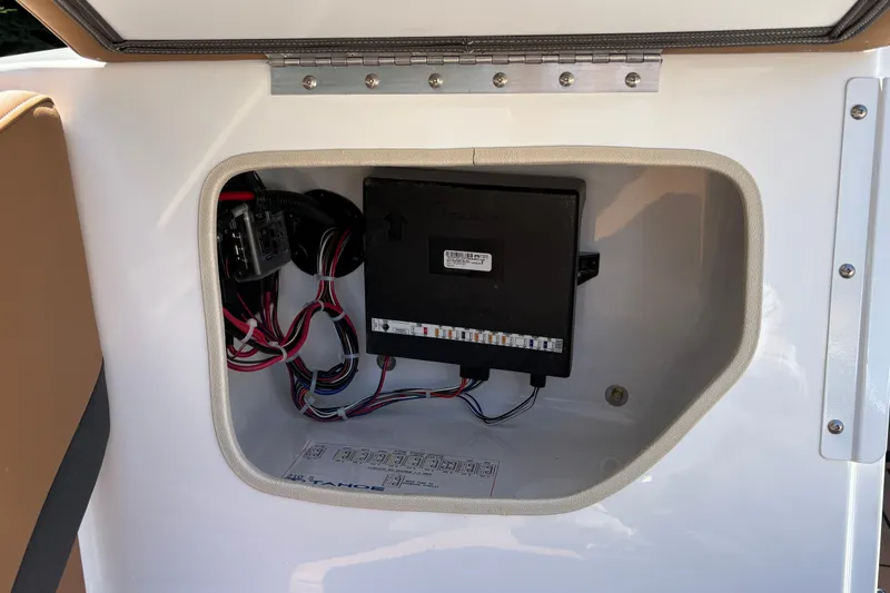 Slide: The Image of Electrical compartment of 2027 Tahoe 210 S boat, showcasing wiring and components. - 36