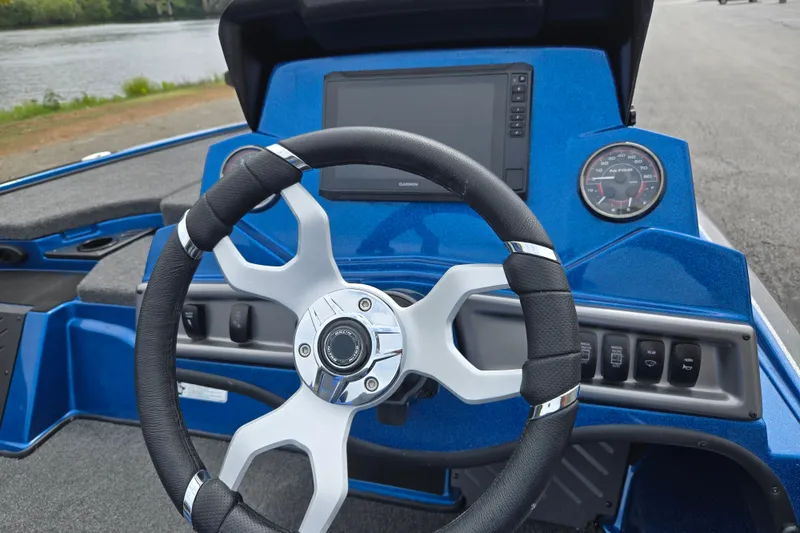 Slide: The Image of Steering console of 2027 Nitro Z18 XL Pro boat with modern controls and display. - 13