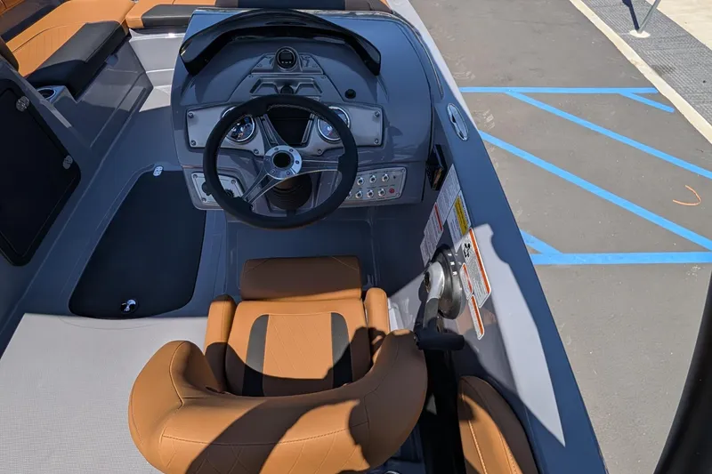 Slide: The Image of Interior view of 2027 Tahoe 2150 boat cockpit with steering wheel and controls. - 13