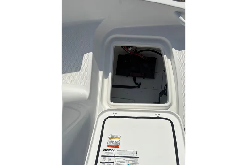 Slide: The Image of Open storage compartment in 2027 Tahoe 2150 CC boat, showing interior details. - 10