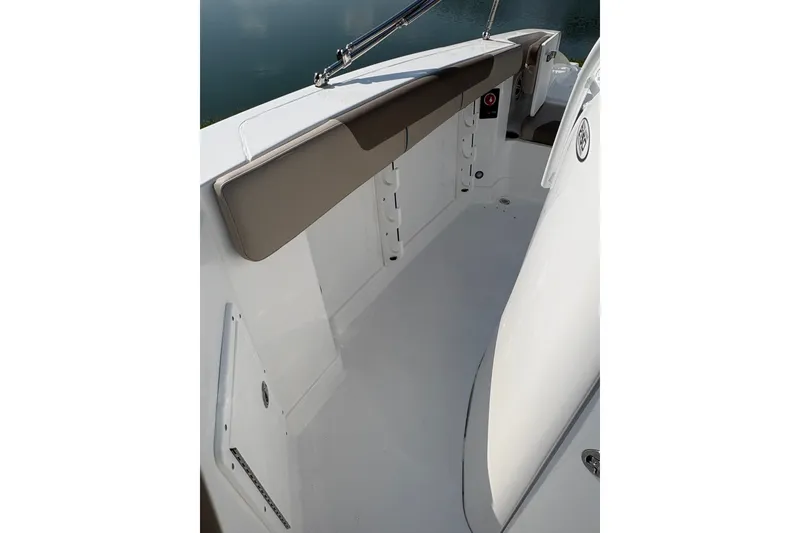 Slide: The Image of Interior view of 2027 Tahoe 2150 CC boat, featuring sleek white design and seating area. - 15