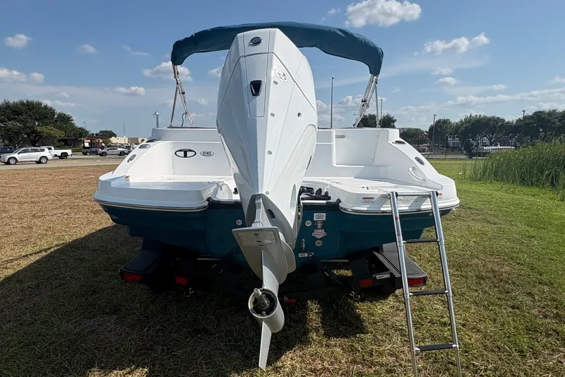 Slide: The Image of The image shows a 2027 Tahoe 2150 CC boat on a trailer, with a ladder at the stern. - 4