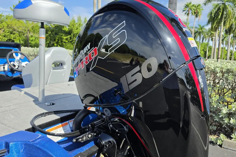 Slide: The Image of 2027 Nitro Z18 XL Pro boat with Mercury Pro XS 150 engine, outdoor setting. - 17