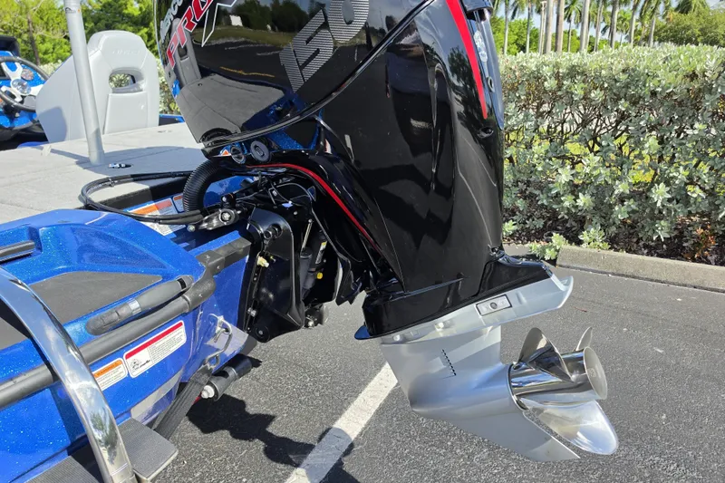 Slide: The Image of 2027 Nitro Z18 XL Pro boat engine and propeller in a sunny outdoor setting. - 16