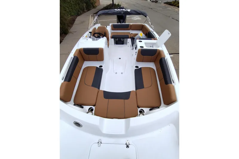 Slide: The Image of 2027 Tahoe 2150 boat interior with tan and black seating, spacious layout. - 14