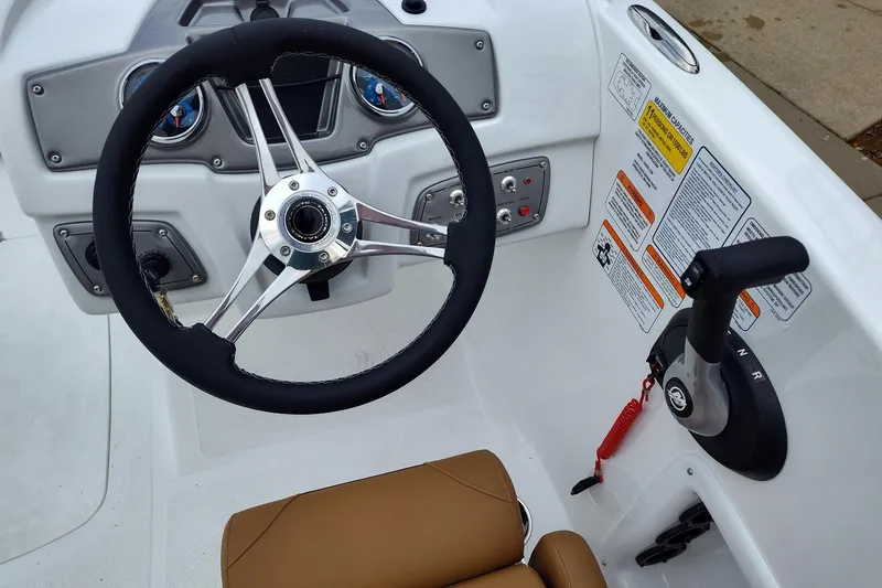 Slide: The Image of Steering console of 2027 Tahoe 2150 boat with controls and gauges. - 8