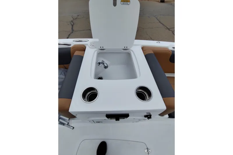 Slide: The Image of 2027 Tahoe 2150 boat interior with sink and cup holders. - 11