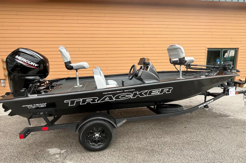 The Image of 2027 Tracker Pro Team 175 boat with Mercury engine, displayed on a trailer. - 0
