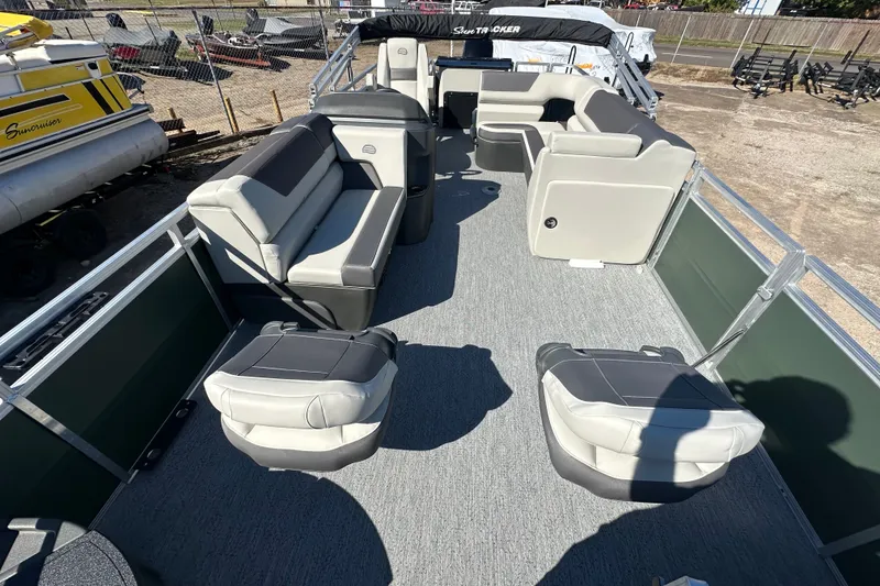 Slide: The Image of 2027 Sun Tracker Fishin' Barge 22 DLX interior with spacious seating and modern design. - 14
