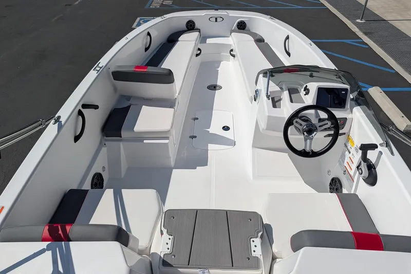 Slide: The Image of 2027 Tahoe T18 boat interior with modern seating and steering console. - 11