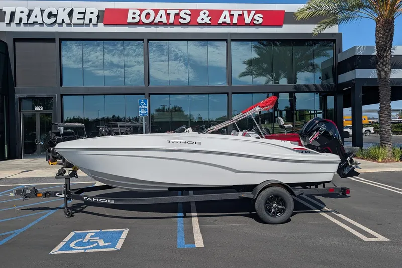 The Image of 2027 Tahoe T18 boat on trailer outside Tracker Boats & ATVs dealership. - 0