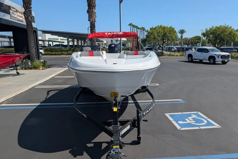 Slide: The Image of 2027 Tahoe T18 boat on trailer in parking lot, sunny day. - 2