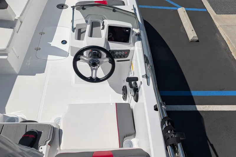 Slide: The Image of 2027 Tahoe T18 boat cockpit with steering wheel and control panel. - 9
