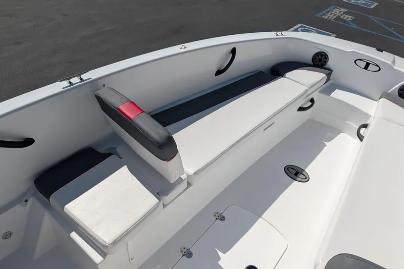 Slide: The Image of 2027 Tahoe T18 boat interior with white and gray seating, modern design. - 10