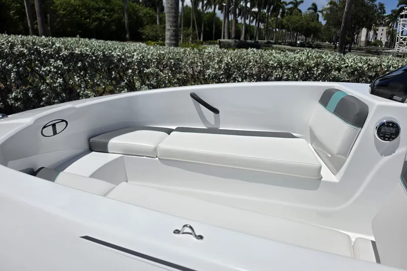 Slide: The Image of Interior view of 2027 Tahoe T16 boat with white seating and modern design. - 10