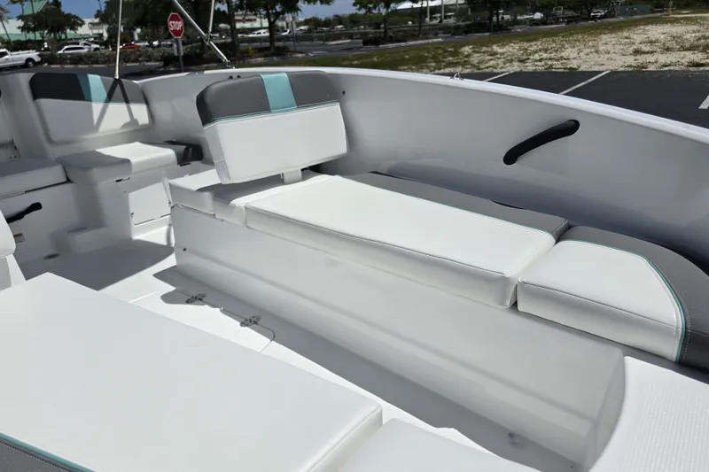 Slide: The Image of Interior of 2027 Tahoe T16 boat with white cushioned seating. - 7