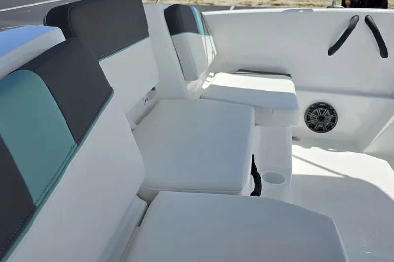 Slide: The Image of 2027 Tahoe T16 boat interior with cushioned seating and speaker system. - 9