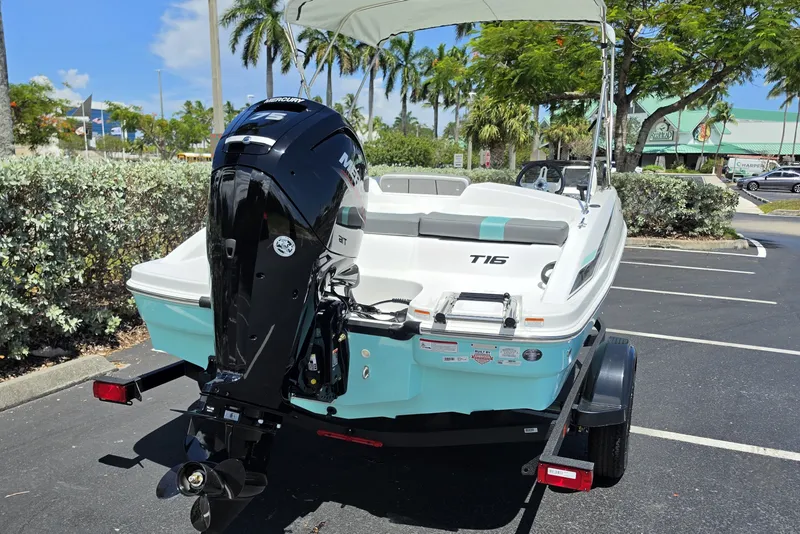 Slide: The Image of 2027 Tahoe T16 boat with Mercury engine in a sunny parking lot. - 11