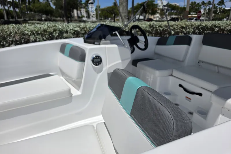 Slide: The Image of 2027 Tahoe T16 boat interior with modern seating and steering wheel. - 8