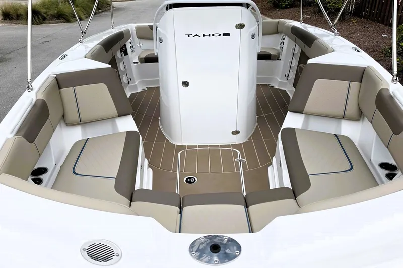 Slide: The Image of 2027 Tahoe 2150 CC boat interior with beige and brown seating, showcasing spacious design. - 16