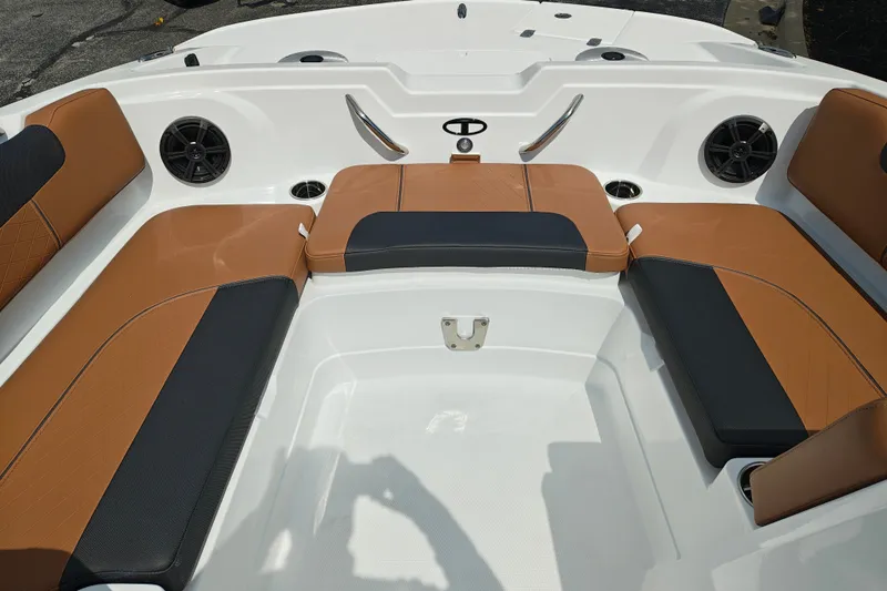 Slide: The Image of Interior of 2027 Tahoe 1950 boat with brown and black seating. - 133