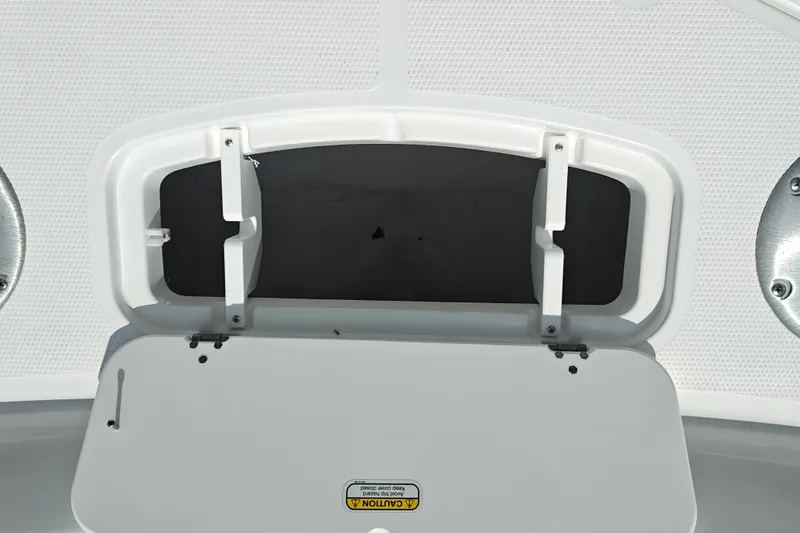 Slide: The Image of Open storage compartment on a 2027 Tahoe 1950 boat, featuring a white textured surface. - 138