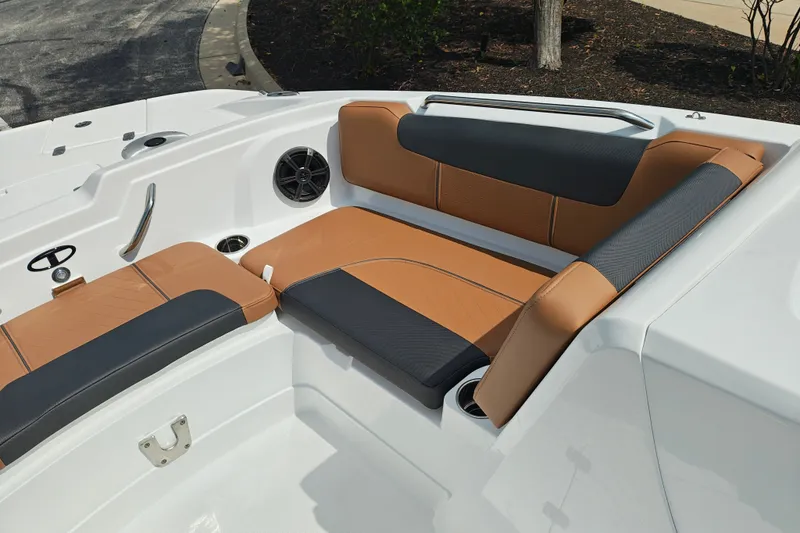 Slide: The Image of Luxurious seating on 2027 Tahoe 1950 boat with tan and black upholstery. - 132