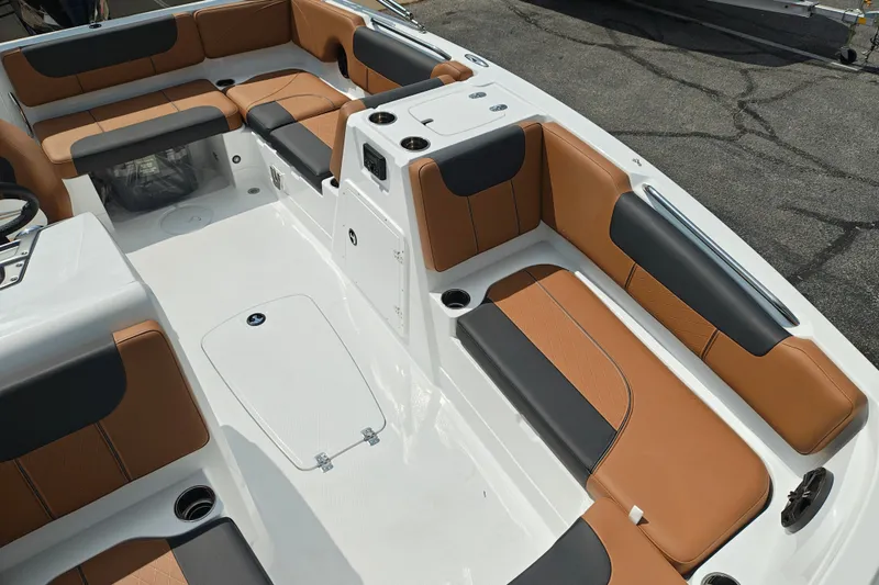 Slide: The Image of Spacious interior of 2027 Tahoe 1950 boat with stylish tan and black seating. - 142