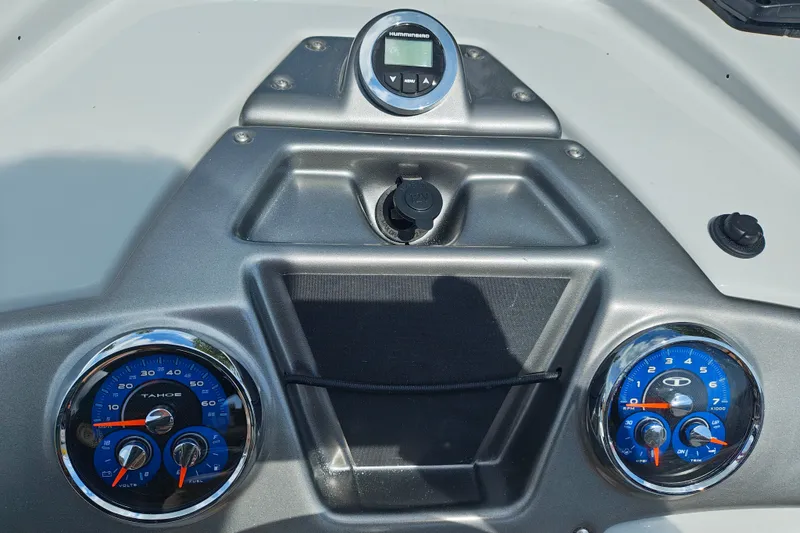 Slide: The Image of Dashboard of 2027 Tahoe 1950 boat with blue gauges and digital display. - 122