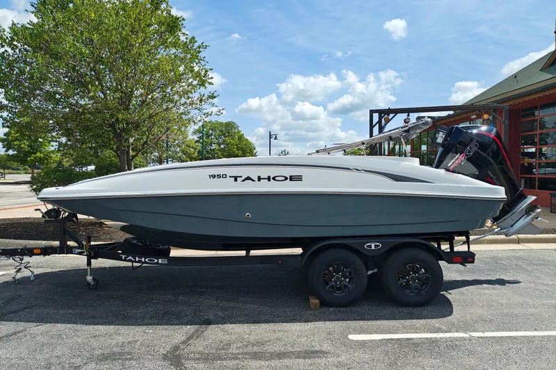 The Image of Tahoe 1950 boat on trailer, 2027 model, parked outdoors under a clear sky. - 108