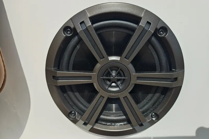 Slide: The Image of Close-up of a Tahoe 1950 speaker, model year 2027, with a sleek black grille design. - 135