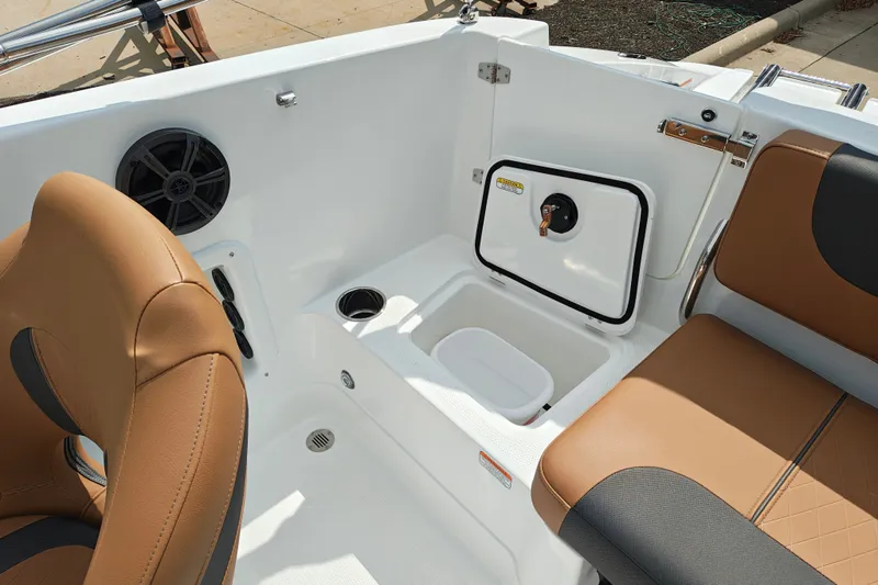 Slide: The Image of Interior of 2027 Tahoe 1950 boat with tan seating and storage compartment. - 146