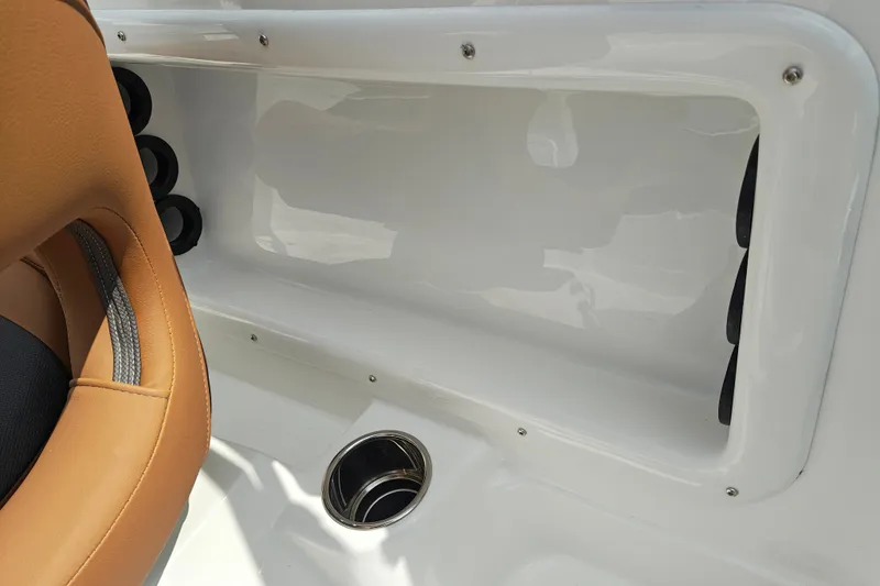 Slide: The Image of Interior of 2027 Tahoe 1950 boat with tan seating and cup holder. - 147