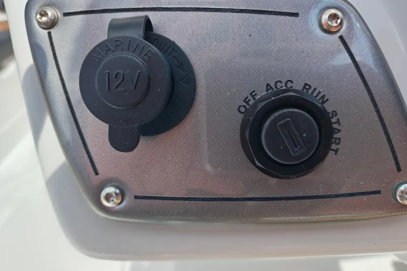 Slide: The Image of 12V marine power outlet and ignition switch on Tahoe 1950, 2027 model. - 123