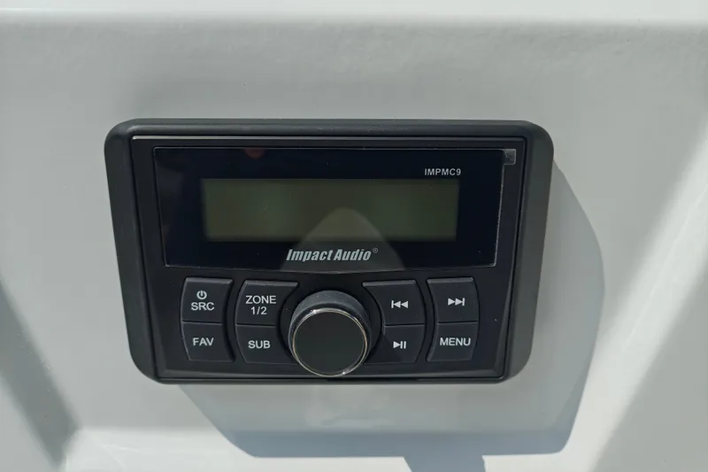 Slide: The Image of Impact Audio control panel on Tahoe 1950, 2027 model boat dashboard. - 129