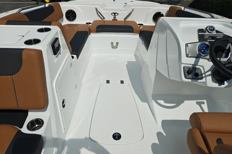 Slide: The Image of Interior of 2027 Tahoe 1950 boat with brown and black seating, modern dashboard. - 120