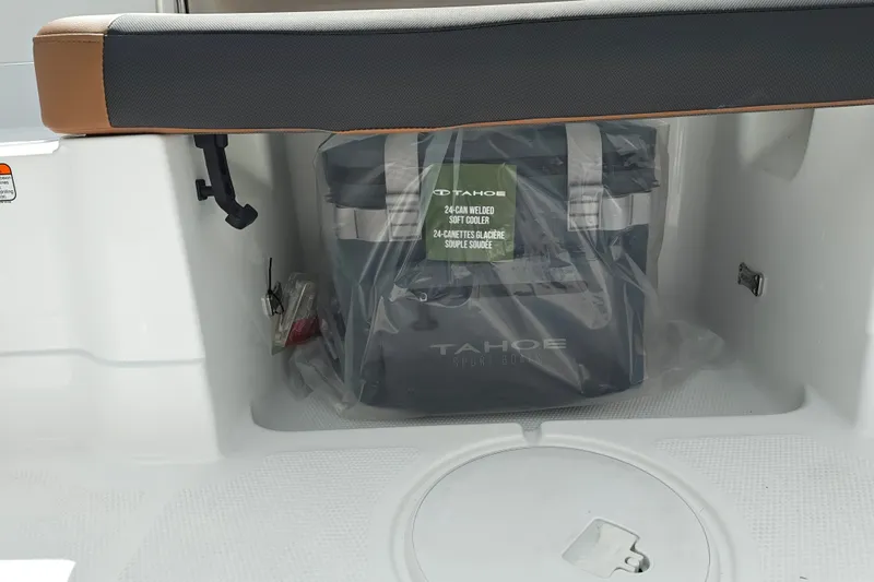 Slide: The Image of 2027 Tahoe 1950 boat interior with a 24-can soft cooler. - 144